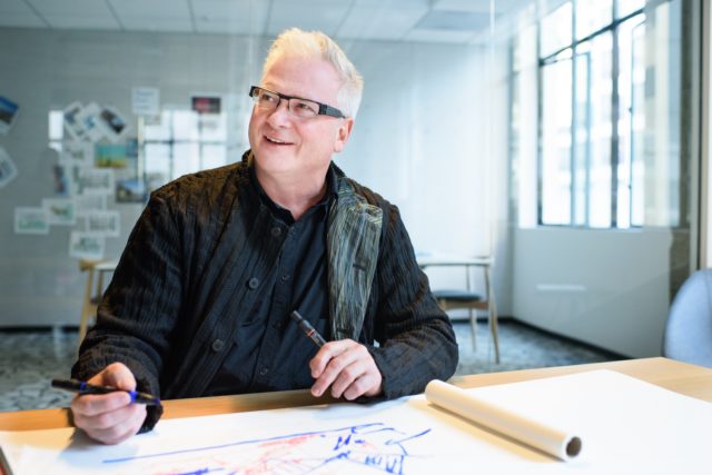 Robert Claiborne, an award-winning architect, working on a sketch.
